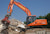 Гусеничный экскаватор Doosan DX225LC на переработке отходов